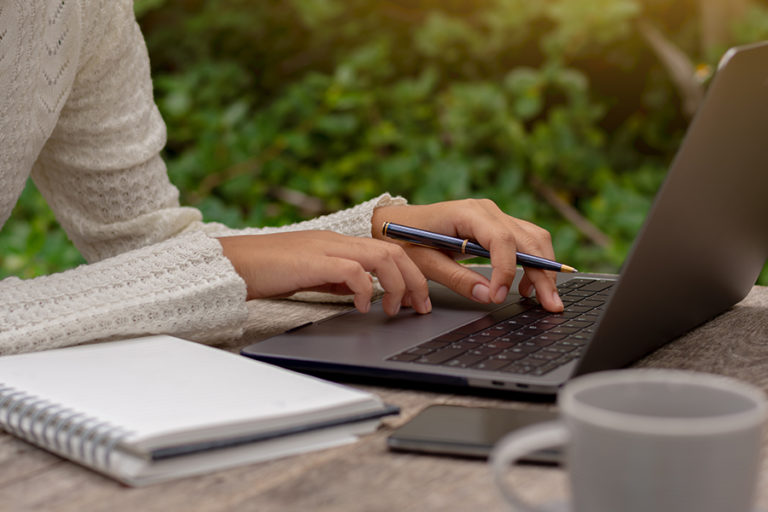 hand at laptop